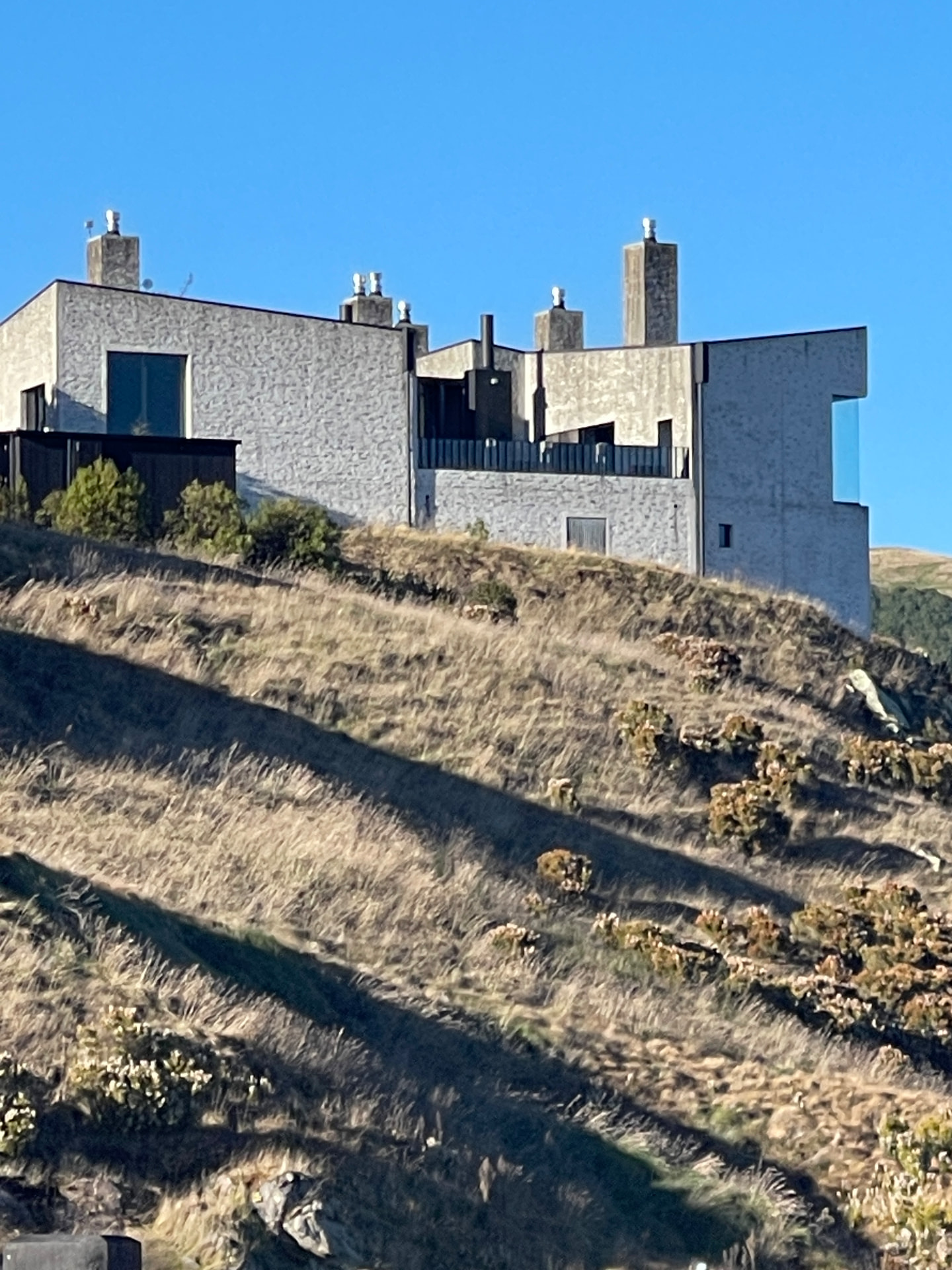 The Manor and lodges of the golf course complex on the ridge above tussock slopes